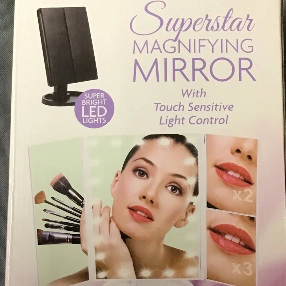 NWOT MAGNIFYING MIRROR WITH TOUCH SENSITIVE
